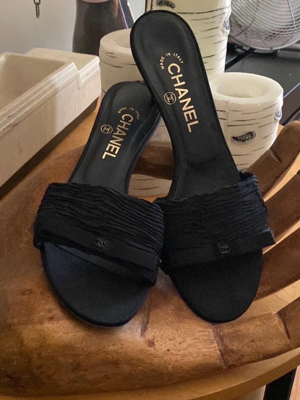Chanel kitten heel slides with bow in black. 2 in heel